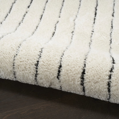 Wool runner rug with boho-style tufts 