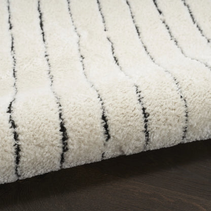 Wool runner rug with boho-style tufts 