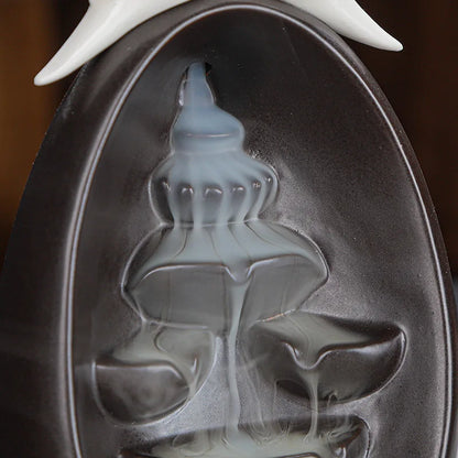 Quemador de incienso fuente cascada humo