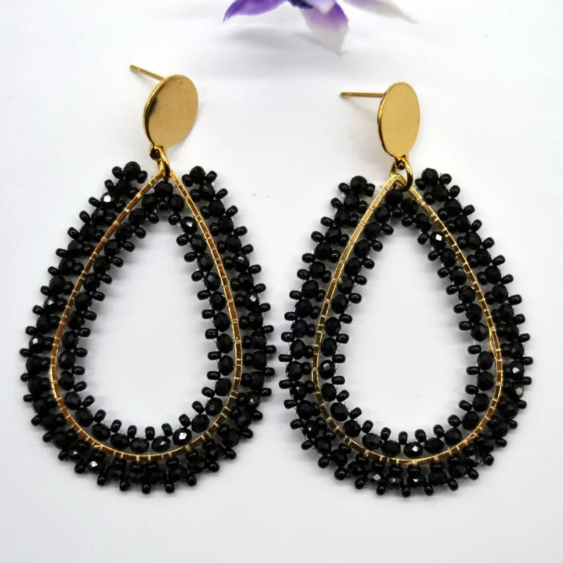 Pendientes de cuentas de arroz retro de moda bohemia con cristal ahuecado tejido a mano