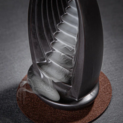 Quemador de incienso fuente cascada humo