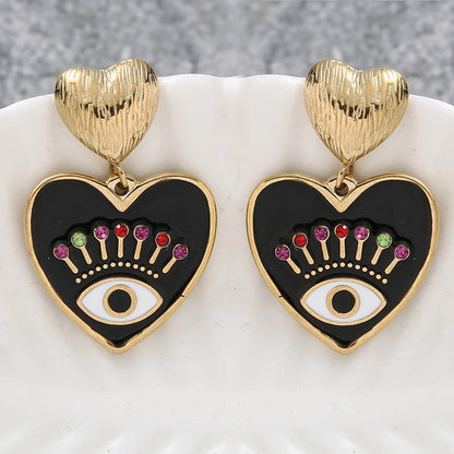 Pendientes de acero inoxidable eyes chapado en oro de 14k